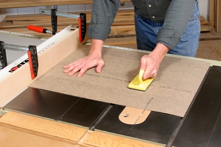 Using a carbide tipped saw blade to cut sheet of plastic laminate