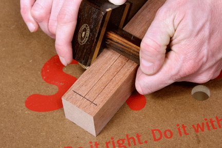 Using mortising gauge to mark out joinery cut