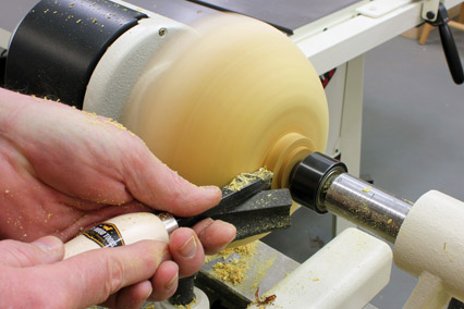 Cutting natural edge bowl tenon for mounting on the lathe