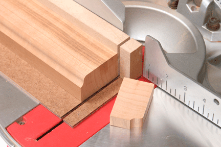 Making miter saw cut through sacrificial fence