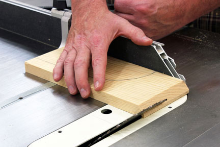Cutting a pivot guide on a table saw