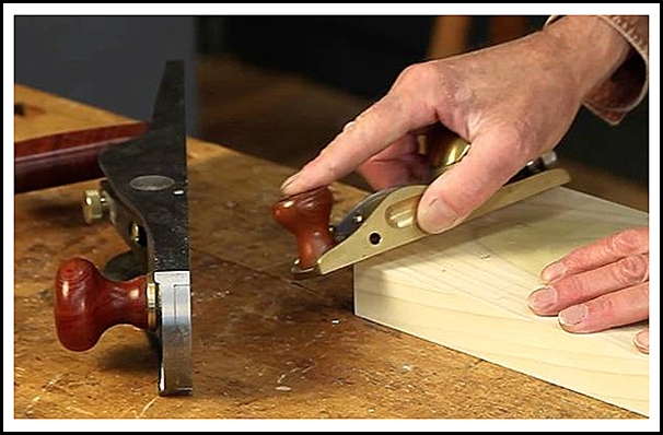 Using a low angle block plane to cut a board's edge