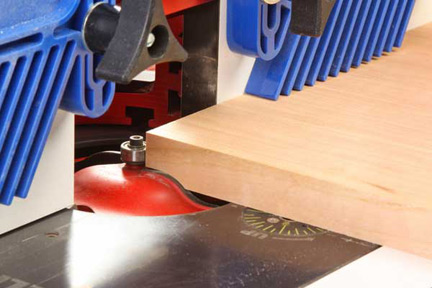 Cutting cabinet panel with a panel raising router bit