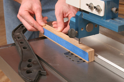 Ripping custom plug blank in half with band saw and rip fence
