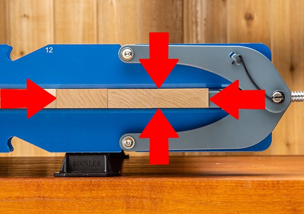 clamps applying force across and to flatten panel