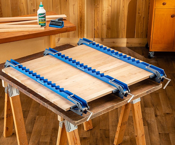 large wood panel in clamps