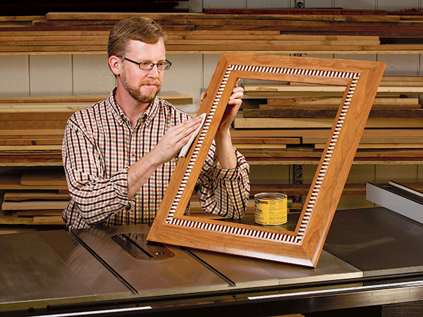 Polishing a picture frame with a dentil inlay