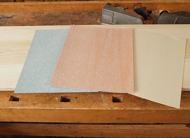 A selection of different brands and grits of sandpaper