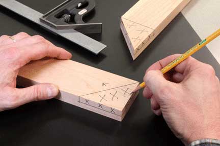 Using pencil to mark waste for cutting half-lap joint