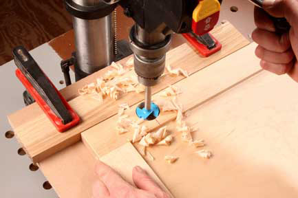 Drilling a hole with a forstner bit to install a european-style hinge cup