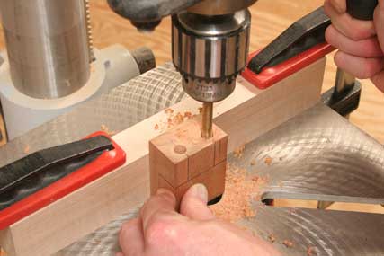Drilling holes for bushings in dowel jig