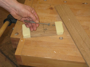 Drilling out the ends of slot for napkin holder mechanism