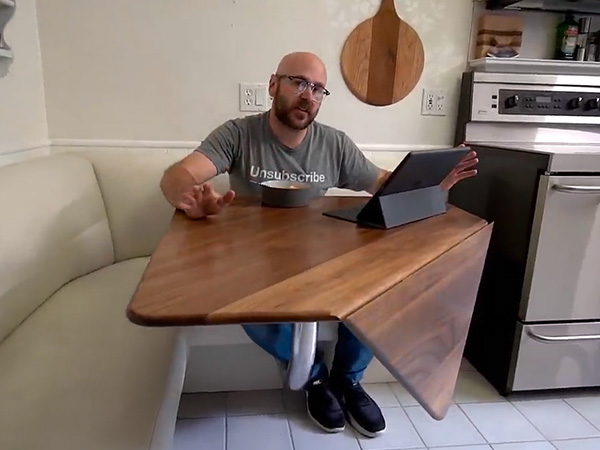 David Picciuto sitting at his drop leaf table