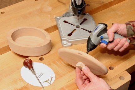 Screwing knob into the lid of keepsake box