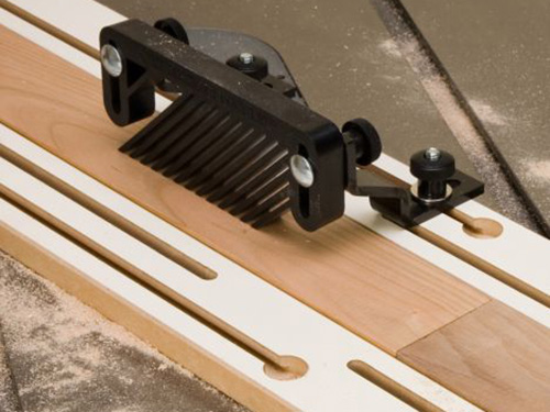 Using a featherboard to guide table saw cut