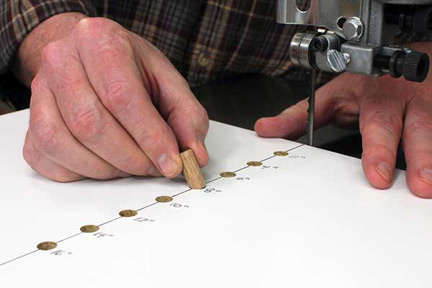 Setting dowel pivot in circle cutting jig