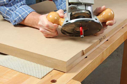 Routing the edges of MDF tabletop with flush trim bit