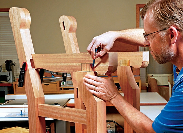 woodworker measuring a mortise and tenon joint