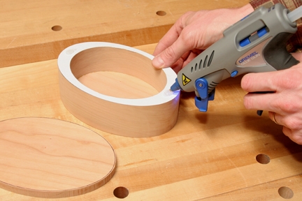Using hot melt glue to mount lid to top of keepsake box