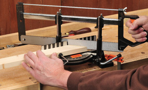 Using a handsaw and miter box to cut smooth miters