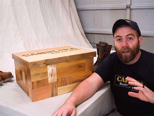 Paul Jackman displays a multi-panel pallet wood boot box with secret compartment