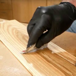 applying stain on wood
