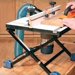 man using router table