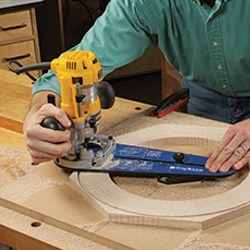 man using hand router