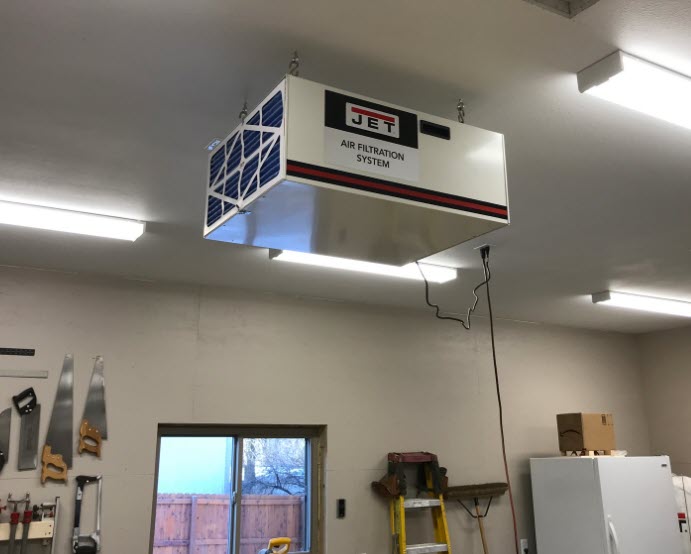 Jet air filtration system handing from workshop