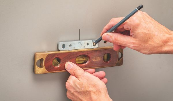 leveling baseplate on wall