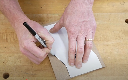 tracing a template pattern on a piece of wood