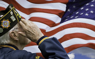 man saluting united states flag