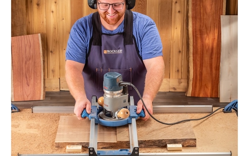 man using board flattening jig