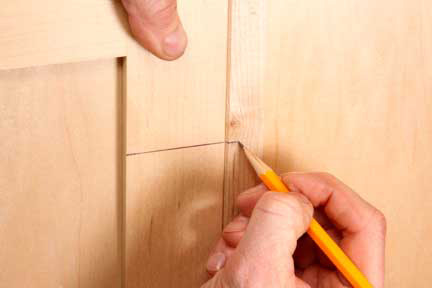 Pencil marking location for hinge installation