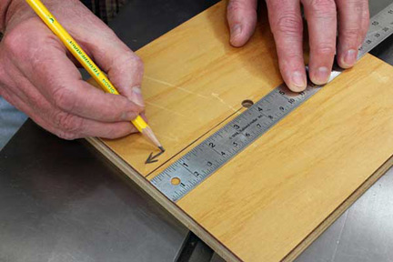 Marking the front edge of workpiece before sawing
