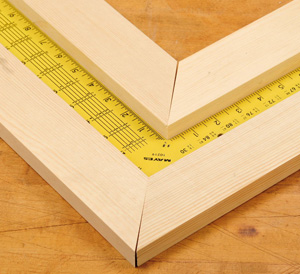Using a square to measure the angle of a miter joint