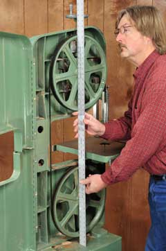 Checking the alignment between two band saw wheels