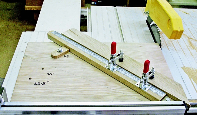 Sled for cutting miters at a table saw