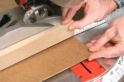 Sacrificial miter saw fence made from scrap