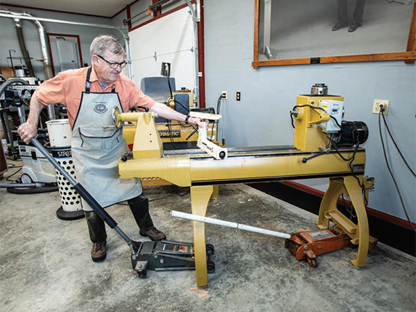 Using a jack to lift and move a full-size lathe