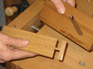 Notches cut in napkin holder rail for sliding mechanism