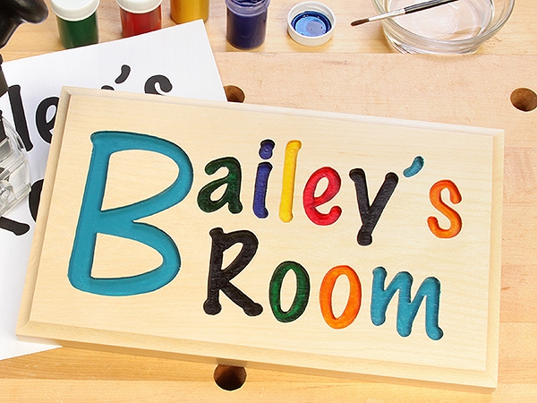 Carved and painted lettering in a sign