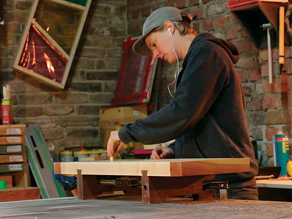 Laura Kampf using her portable workbench