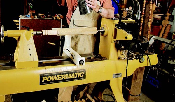 Setting up a large Powermatic lathe in a woodturning shop
