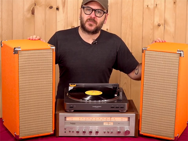 David Picciuto showing plywood speakers designed like vintage guitar amps