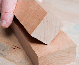 Close-up of different wood grains on cherry sideboard parts