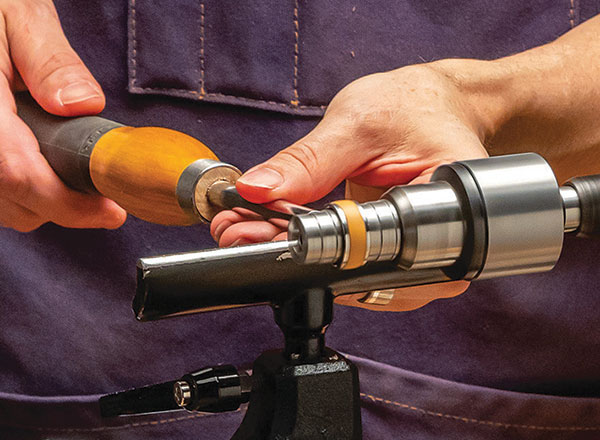 man turning a ring on a lathe