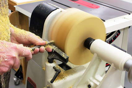 Using gouge to rough turn a natural edge bowl blank