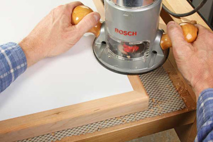 Making edges of workshop table smooth with a roundover bit