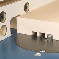 Cutting slots in a board with a router
